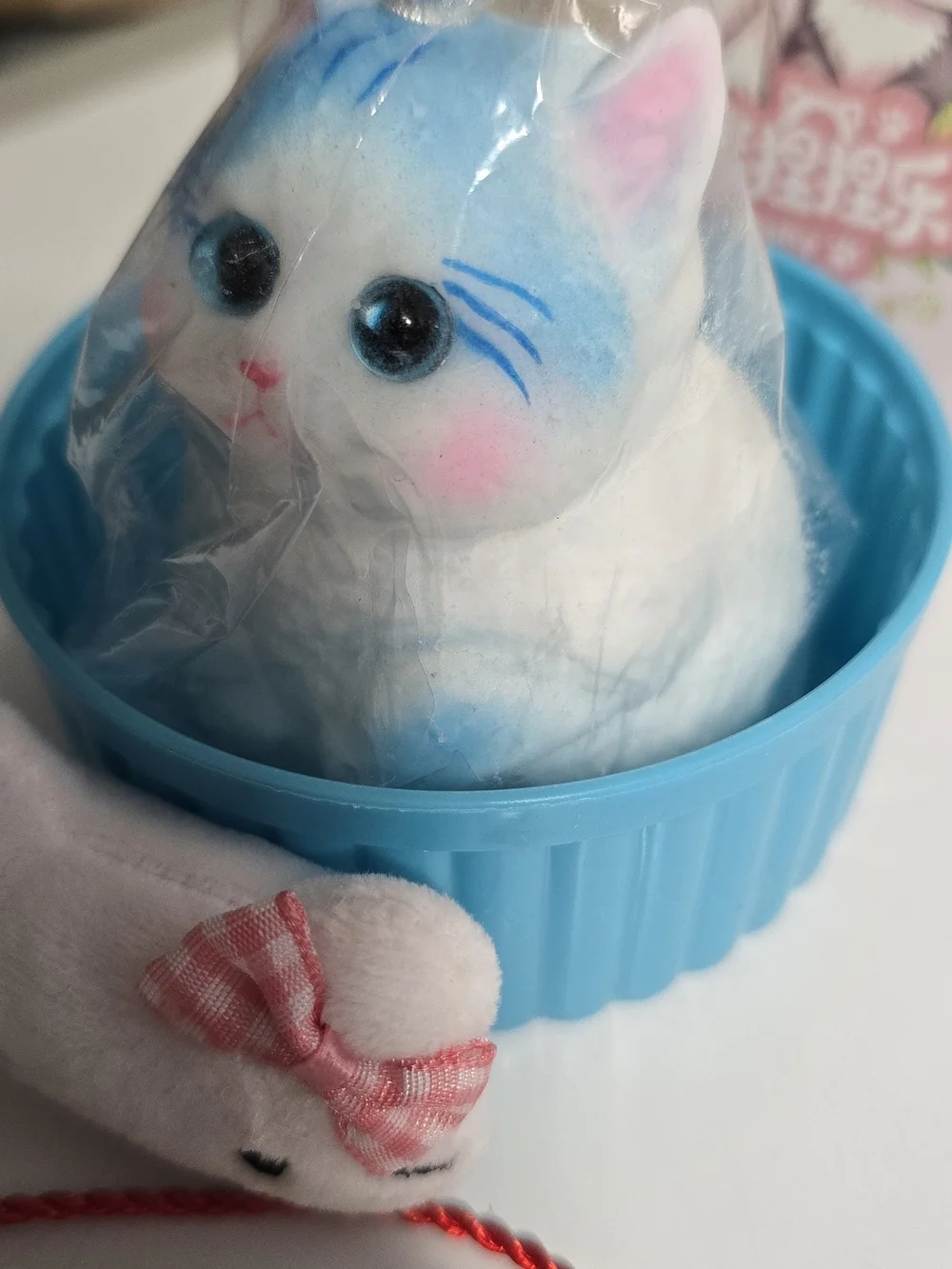 Blue & White Kitty Squishy with Crown in Blue Dish